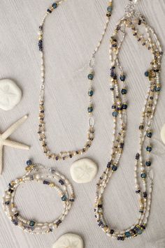 This transitional piece offers versatility in wear. It is a collage featuring fresh water pearl, kyanite, and iolite, with beading and gemstone chains. The piece can be worn as a single necklace or wrapped around your wrist and worn as a bracelet. However, the necklace can also be clasped to another piece in this collection (SEA043C) to have a long collage necklace that can be worn wrapped at the neck (see last two photos). Sterling silver (lead and nickel free) Fresh Water Pearl, Kyanite, Iolit Fresh Water Pearls Jewelry, Collage Necklace, Baroque Pearls Jewelry, Single Necklace, Fresh Water Pearl Necklace, Jewlery Necklace, Water Pearl Necklace, Freshwater Pearl Jewelry, Designer Handmade Jewellery