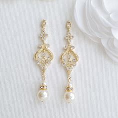 14K Yellow Gold Plated Vintage Inspired Bridal Earrings These vintage gold earrings are a seamless match with your vintage wedding styling. These vintage-style gold earrings are plated in 14K gold, the color of which is nither too dark not it is light. The earrings look delicate and lovely, made with sparkly cubic zirconia and available with pearl drops of cream or white color. You can also choose between round and teardrop pearl in the choice of pearl color. The length of the earrings 2.45 inch Pretty Jewellery Earrings, Vintage Bridal Earrings, Elegant Gold Earrings, Pearl Drop Earrings Bridal, Long Pearl Earrings, Vintage Gold Earrings, Bridal Jewelry Vintage, Vintage Earring, Gold Earrings Wedding