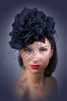 Very Elegant veiled navy blue fascinator with big flower which will be a star at Royal Ascot, Melbourne cup or Kentucky derby. Also can be worn on a Summer weddings, tea and garden parties.This fascinator is made from navy sinamay base, decorated with a big rose, which petals are made from viscose to perfection at Irina Sardareva Couture Millinery.This fascinator in navy blue color and is 1 pcs. available. OOAK headpiece.It is suitable for all head sizes.All deliveries are made by TNT or FedEx s Kentucky Derby Fascinator Hat For Fashion Events, Kentucky Derby Fascinator For Fashion Events, Evening Fascinator With Handmade Flowers, Chic Blue Fascinator For Races, Kentucky Derby Evening Fascinator With Handmade Flowers, Elegant Navy Hat For Evening, Navy Hat For Kentucky Derby Party, Handmade Flowers Fascinator For Kentucky Derby Evening, Navy Party Hat For Kentucky Derby