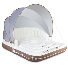 an inflatable bed is shown with its canopy opened to reveal the inner structure