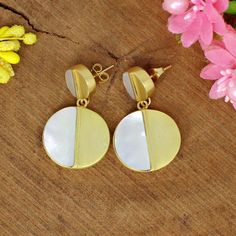 Half Moon Earrings- Mother Of Pearl Dangling Earrings- Gold Plated Brass Earrings- Handmade Gemstone- Anniversary Gifts- Boho Jewelry Description: Weight : 18.57 Gram Approx Gemstone : Mother of Pearl Stone Size : 19 x 10 MM Approx, 10 x 5 MM Approx Material : Brass, Gemstone Metal : Brass ❣❣ Handmade Item ❣❣ **Made to Order** » G EM S T O N E D E T A I L « **Gemstone structure may vary from the image as two gemstones do not have the same structure** If you want to see the picture of gemstone, t Handmade Round Mother Of Pearl Earrings, Unique Dangle Mother Of Pearl Earrings, Bohemian Gold Mother Of Pearl Earrings, Yellow Gold Mother Of Pearl Earrings, Adjustable Round Mother Of Pearl Earrings, Brass Earrings Handmade, Half Moon Earrings, Simple Bangle, Mother Of Pearl Earrings