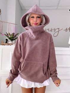 Meet the Hazelnut Haven Pullover from Sassy Shortcake! This cozy brown hooded fuzzy ninja pullover is the ultimate in laid-back style and comfort. With its plush texture, you’ll feel like you’re wrapped in a warm hug, perfect for chilly days or lounging at home. The stylish hood adds a touch of flair, while the kangaroo pocket is perfect for keeping your hands warm or stashing your essentials. Whether you’re running errands or enjoying a cozy night in, this pullover is your go-to piece for effor Cozy Hoodie With Soft Texture, Cozy Hooded Hoodie With Soft Texture, Cozy Soft Knit Hoodie For Cold Weather, Cozy Fleece Hoodie With Funnel Neck, Cozy Brown Fleece Sweater, Cozy Brown Sweatshirt For Loungewear, Cozy Brown Hooded Sweatshirt, Cozy Sweater With Kangaroo Pocket, Cozy Sweater With Kangaroo Pocket For Loungewear