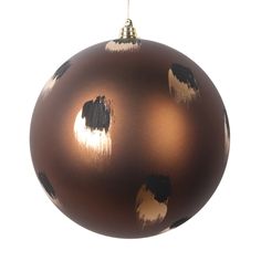 a brown ornament with black spots on it