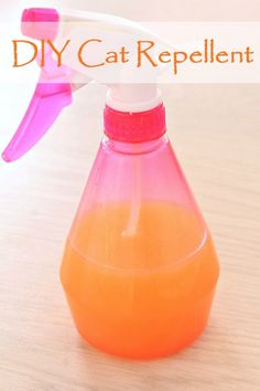 an orange and pink liquid in a plastic bottle with a sprayer on top that says diy cat repellent