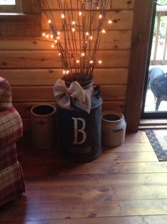 a christmas tree with lights is in a bucket