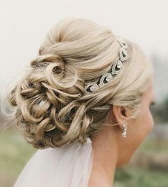 a woman with blonde hair wearing a tiara