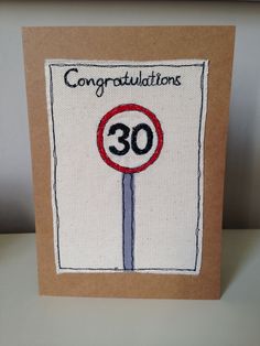 a handmade congratulations card with a street sign and the number 30 on it's front