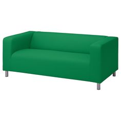 a green couch sitting on top of a white floor