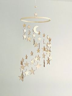 a mobile with stars and crescents hanging from it's side in a room