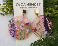 Unusual pink transparent earrings with delicate flowers.  Flowers are painted by me. Very nice effect. photography does not convey all the tenderness and beauty of the decoration.  Hand-made earrings,  hand-painted floral design in acrylics.  Hypoallergenic stainless steel cube posts in 18K real Gold Plated. circle diameter 32 mm, 1,2 inc. cube size 5 x 5 mm Pink Pressed Flower Earrings For Gift, Unique Pink Flower Earrings As Gift, Unique Pink Flower Earrings For Gifts, Pink Floral Print Jewelry As Gift, Hand Painted Pink Earrings For Gift, Hand Painted Pink Earrings For Gifts, Pink Hand Painted Earrings For Gift, Pink Drop Earrings With Birth Flower, Handmade Blush Earrings As A Gift