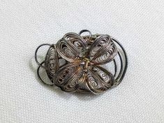 Pretty vintage silver tone flower brooch. Floral theme. C1950's. Decorative mount. Mid century. Gift idea. Tracked shipping from my vintage store, Bags Of Fun in Cyprus.  If you are outside of the EU customs charges may apply.   If you're in the EU you have the right to return this item within 14 days of arrival for a full refund. Retro Silver Brooch Pin, Silver Retro Brooch Pin, Retro Silver Brooches For Anniversary, Silver Retro Brooches For Anniversary, Vintage Silver Flower Pins, Vintage Silver Brooches For Vintage Events, Silver Vintage Brooches For Events, Retro Silver Brooches For Formal Occasions, Antique Silver Vintage Brooches As Gift