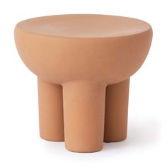 the stool is made out of clay and has two legs that are bent to one side