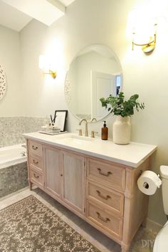 a bathroom with a sink, mirror and toilet