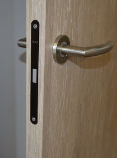 an open door with a metal handle on it