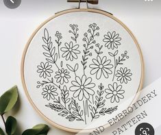 a cross stitch pattern with flowers on it