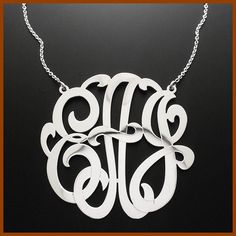 "Our Cutoff Date for Christmas delivery is Sunday Dec. 13, 2020 All Order placed after this date will be completed for mid January delivery. Orders submitted by December 18, 2017 will receive FREE SHIPPING UPGRADE for a Christmas Delivery This Personalized monogram necklace is 1.25 inch in diameter and about 0.5mm thick, made of solid 14kt. white gold with rhodium plating. Pendant suspends from a cable Link chain with 3 choices of length: 14\",16\" and 18\". The Monogram can be made with the ini Luxury Silver Custom Necklace For Personalized Gift, Elegant Monogram Jewelry For Anniversary Gift, Elegant Monogram Jewelry For Anniversary, Luxury White Monogram Jewelry, Formal Monogram Sterling Silver Jewelry, Luxury Initials Jewelry For Mother's Day, Luxury Monogram Silver Necklace, Luxury Silver Monogram Necklace, Luxury Monogram Jewelry For Personalized Gift