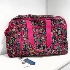 Vera Bradley Kaleidoscope Rosettes Lighten Up Duffle Bag Brand New With Tags! Great Condition And Never Used Great Storage And Many Pockets Perfect For Traveling Or Overnight Bag Pink Floral Print Rectangular Bag, Rectangular Pink Floral Print Bag, Pink Floral Print Bag For Everyday Use, Vera Bradley Weekender Bag, Vera Bradley Duffel Bag, Vera Bradley Duffle Bag, Confetti Bags, Vera Bradley Travel Bag, Red Long Sleeve Dress