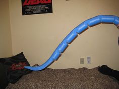 a bed with a blue tube on top of it