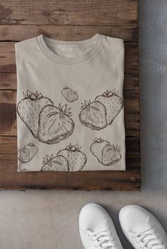 Thanks for stopping by! Strawberry cottagecore T-shirt Printed on a super soft, cotton tee Dispatched in 5 working days or sooner Unisex Free UK delivery Material: 100% ringspun cotton. Chest (to fit): S  34/36   M  38   L  40/42   XL  44/46   XXL  48/50 ECO-FRIENDLY Each garment is made to order, reducing extra material and energy that would be otherwise wasted We use DTG printing process which is easier on the environment than screen-printing Our ink is bright and also eco-friendly. Do not tum Vintage Hand Printed Short Sleeve T-shirt, Vintage Hand-printed Short Sleeve T-shirt, Hand Printed Organic Cotton T-shirt, Vintage Hand Printed Crew Neck Tops, Hand Printed Organic Cotton T-shirt, Relaxed Fit, Hand Printed Organic Cotton T-shirt In Relaxed Fit, Hand Printed Relaxed Fit Organic Cotton T-shirt, Hand Printed Crew Neck Graphic Tee, Hand Printed Graphic Tee With Crew Neck