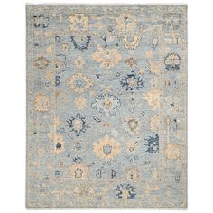 an area rug with blue, yellow and beige colors on the bottom half of it