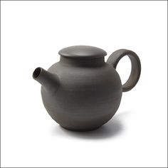 a gray teapot with a black lid on a white background, it is empty