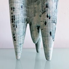 an artistic tooth sculpture is displayed on a table