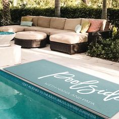 a pool with a couch and table next to it