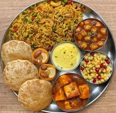 a metal plate topped with different types of food