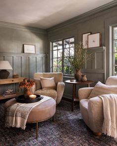 a living room with two chairs and a coffee table