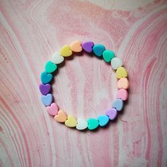 Pastel rainbow heart beaded bracelet. The size is a measurement of the inner circumference of the bracelet. If you would like a specific or different size, choose custom in the drop-down menu, and leave me a personalisation note of the measurement of your wrist or the size required. X SMALL: 4-5 inches SMALL: 5-6 inches MEDIUM: 6-7 inches LARGE: 7-8 inches X LARGE: 8-9 inches Care tips: take off before baths and swimming, don't pull/stretch the bracelet, don't spray perfume directly on the beads Fan Bracelet, Affirmation Bracelets, Making Bracelets With Beads, Spray Perfume, Rainbow Heart, Perfume Spray, Heart Beads, Pastel Rainbow, Care Tips