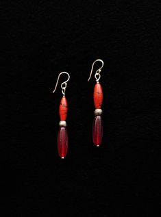 Handmade red glass beads dangle earrings. These red and silver earrings are made of old red Nepali glass beads, and antique African red glass beads. The red Nepali beads have a black swirl in them and the red glass beads from Africa have the most beautiful red hue. These are visible old antique beads. These beads are separated by an Ethiopian metal silver plated bead. A silver earwire finishes these unique, ethnic style dangle earrings. Total length including 925 silver ear hook 65 mm. Dangle le Dangle Earrings Silver, Beaded Dangle Earrings, Ear Hook, Ethnic Style, Antique Glass, Silver Earrings Dangle, Beaded Dangles, Red Glass, Ethnic Fashion