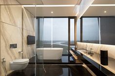 a modern bathroom with black and white decor