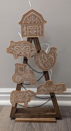 a christmas tree made out of wood and decorated with ornaments