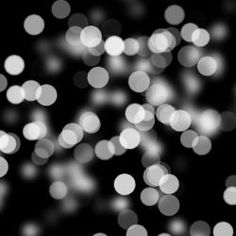 black and white boket background with lots of small circles in the center,