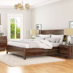 a bedroom with white walls and wooden furniture