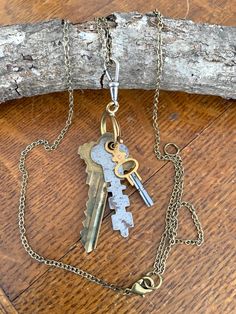 "If these keys could talk! What secrets did they keep? What doors or treasure boxes did they open back in the day...? Well today they find themselves assembled into a modern day necklace collage with a decidedly retro feel. I love how the different metal colors, shapes, and textures compliment each other. The keys hang from an enormous reclaimed pocket watch spring ring clasp - yes, this means you can add or subtract trinkets of your own if you like! The clasp is attached to a bronze tone chain Pink Pens, Ithaca Ny, Assemblage Necklace, Vintage Key, Pocket Watch Antique, Vintage Keys, The Keys, Treasure Boxes, Zipped Bag