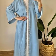 What is inside : - Open Abaya - Inner Dress - Belt Step out in style with this blue abaya 🧕. It's comfy, flowy, and has pretty beads along the edges for a little sparkle ✨. Tie it at the waist for a great fit. Perfect for special days or just looking chic! 🎉 Modest Long Sleeve Blue Kaftan, Blue Modest Long Abaya, Blue Long Abaya For Eid, Long Blue Abaya For Eid, Blue Abaya For Eid, Blue Maxi Length Abaya For Spring, Blue Dabka Maxi Length Abaya, Spring Blue Long Sleeve Abaya, Blue Long Sleeve Thobe For Spring