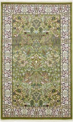 a green rug with an ornate design on the bottom and sides, in various colors