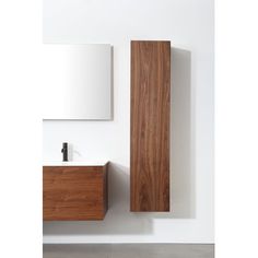 a bathroom with a sink, mirror and wooden cabinet on the wall next to it