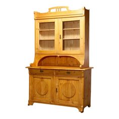 a wooden hutch with two doors and shelves on top of it, against a white background