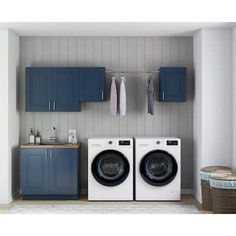 a washer and dryer in a laundry room with blue cupboards on the wall