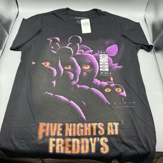 Five Nights At Freddy's Movie Poster T-Shirt Small Can You Survive Having This Killer Tee In Your Wardrobe? Rep Five Nights At Freddy's With This Jumbo Print Tee, Featuring The Animatronics In A Menacing Tonal Print. * 100% Cotton * Wash Cold; Dry Low * Imported * Listed In Men's/Unisex Sizes Fnaf Movie Poster, Five Nights At Freddy's Movie, Freddy Movie, Tonal Prints, Fnaf Movie, Hair Clothes, Print Tee, Five Night, Five Nights At Freddy's