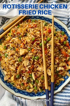 chicken fried rice with chopsticks on a blue and white plate next to it