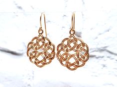 Celtic knot is know as infinity symbol - symbolises life cycle, four seasons, continuity of life cycle, immortality of our spirit. Dimensions: - circle diameter: 20 mm - lenghth (with hook): 35 mm  - thickness: 2 mm  - Weight: 8.2 g Properties: - 14k gold plated silver earrings; or - made from 925 sterling silver; or - made from pure bronze - select from options - bronze earrings have sterling silver hooks; - no overlays; - comfortable for daily wearing; - 100% handcrafted; - ships in beautiful gift box. Shipping: - we prepare our items ready for shipping in around 3 days to 2 weeks - only few items are kept in stock, mostly jewellery is custom made; - shipping to USA/outside EU usually takes ~ 2 weeks, inside EU - 1 week, - the item is nicely packed in a gift box. Our jewelry is made with Viking Jewelry Women Norse Spirit, Celtic Jewelry Ancient, Earrings Celtic, Celtic Jewellery Ancient, Celtic Knot Jewelry The Irish Jewelry Company, Viking Women, Norse Jewelry, Celtic Earrings, Bronze Earrings