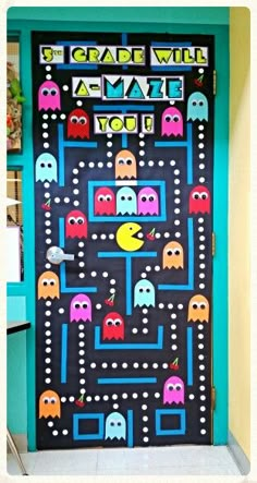 an image of a door decorated with pacman and pac - man game characters on it