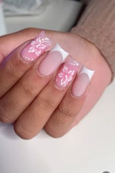 nails pink summer flowers hibiscus french tip white baby pink vacation holiday French Tip With Purple Flower, White French Tip Nails With Hibiscus, Summer Acrylic Nails Hibiscus, White Tip Nails With Design Summer, Pink Nail Flower Designs, White French Tips With Pink Design, Nails Inspo Pink And White, Pink And White Nails With Flowers, Pink White Flower Nails