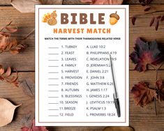 a bible harvest match with leaves and acorns on a wooden table next to it