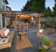 an outdoor living area with fire pit and seating