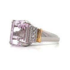 The star of this show is a stunning 9.64 carat emerald cut Kunzite. The soft pink hue of the center stone make it easy to accessorize. Adding to the glamour are six sparkling natural round brilliant cut diamonds, three on each side of the center stone. The platinum setting provides a polished backdrop for the Kunzite while and the 18 karat yellow gold accents on the shoulders add a touch of warmth to the overall design. Luxury Pink Diamond Ring For Formal Occasions, Fine Jewelry Pink Rectangular Rings, Luxury Kunzite Jewelry With Accent Stones, Formal Pink Diamond Ring With Gemstone, Luxury Pink Diamond Gemstone Ring, Luxury Pink Diamond Ring With Brilliant Cut, Pink Morganite Emerald-cut Jewelry, Pink Morganite Diamond Ring, Elegant Style, Luxury Pink Brilliant Cut Diamond Ring