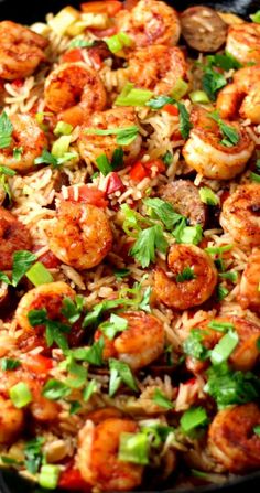 shrimp and rice dish with cilantro on top in a skillet ready to be eaten